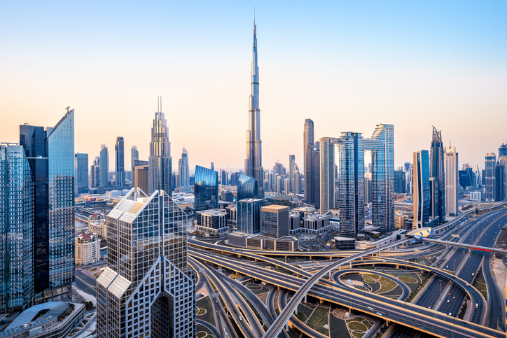Dubai skyline and highway interchange at sunrise
