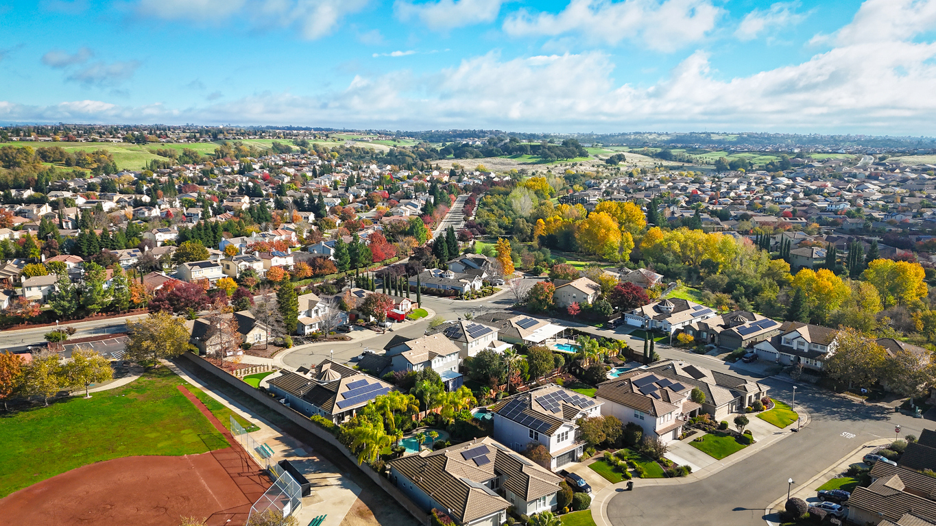 Aerial view of a suburban neighbourhood on a clear autumn day